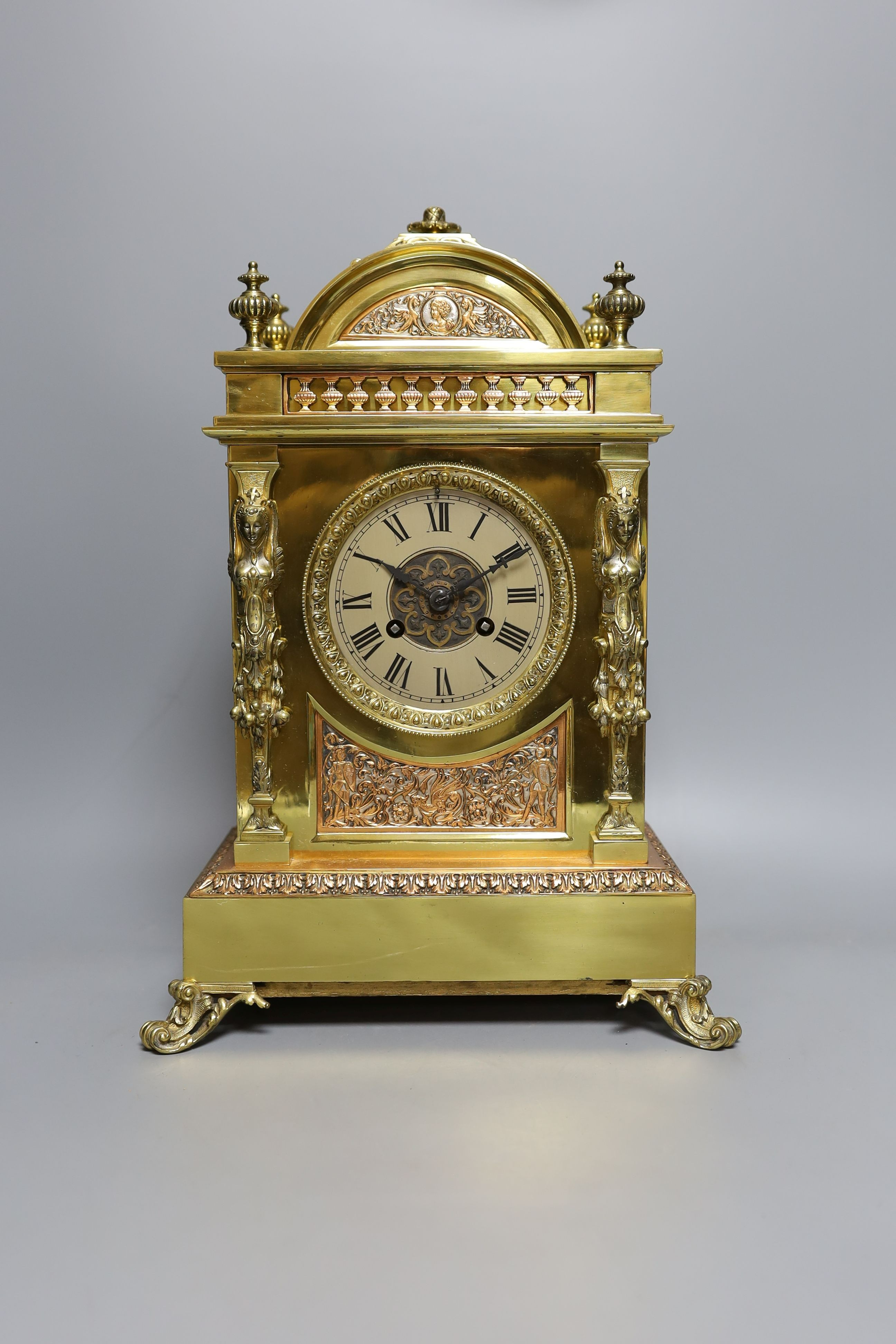 A late Victorian copper and brass mantel clock - 39cm tall